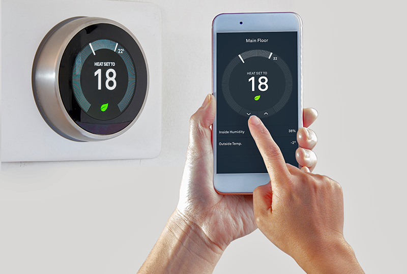 Smart Thermostat With A Person Saving Energy